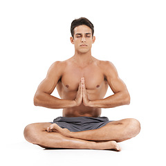 Image showing Man, meditation and yoga in studio for mindfulness or spiritual awareness, zen and namaste pose. Male person, pilates and peace or wellness and healing or relax, fitness and calm by white background