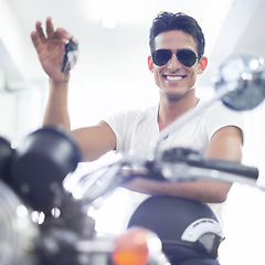 Image showing Happy man, portrait and motorcycle keys with helmet and sunglasses for transportation vehicle in garage. Young male person or biker smile for cool automobile or ownership of mechanical motorbike