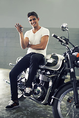 Image showing Happy man, portrait and keys sitting on motorcycle keys for transportation or vehicle in garage. Young male person or biker smile for cool automobile, ownership or mechanical motorbike in parking lot