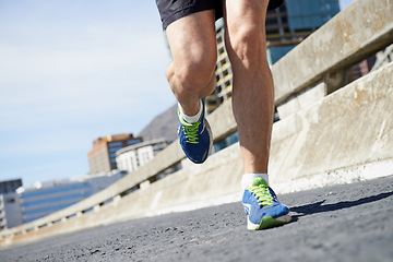 Image showing Legs, running on bridge with exercise and cardio outdoor for health and training for marathon. Fitness in city, runner person in sneakers with speed and energy, sports and athlete on urban street