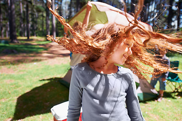 Image showing Happy girl, dancing or camping in park to celebrate freedom on fun outdoor holiday vacation in summer. Woods, playful or excited children with smile for twirling hair or wellness in nature or forest