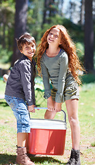 Image showing Cooler box, camping or portrait of friends in nature for playing, adventure or holiday vacation in park. Teamwork, drinks or happy children with smile in woods, garden or forest for hiking or travel