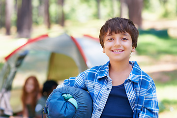 Image showing Sleeping bag, camping or portrait of happy kid in woods for adventure or holiday vacation in park. Relax, start or boy with smile in nature, garden or forest ready for fun hiking, travel or wellness