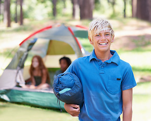 Image showing Sleeping bag, camping or portrait of boy in nature playing, adventure or holiday vacation in park. Relax, start or happy child with smile in woods, garden or forest reading for fun hiking or wellness