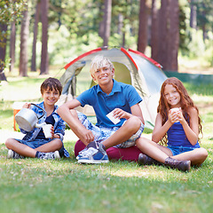 Image showing Camping, children and smile in portrait while outside, bonding and happy for outdoor adventure. Kids, face and eating food together on holiday, friendship and nutrition in nature, relaxing and grass