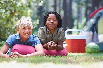 Image showing Camping, children and relaxing in portrait on grass, bonding and happy for outdoor adventure. Kids, face and smiling together on holiday, friendship and vacation in nature, relaxing and ground