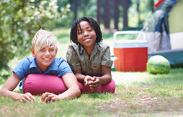 Image showing Camping, children and relaxing in portrait on ground, bonding and boys in outdoor adventure. Happy kids, face and smiling together on holiday, friendship and vacation in nature, outside and grass