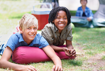 Image showing Camping, children and relaxing in portrait on outdoor adventure, bonding and happy outside. Kids, face and smiling together on holiday, friendship and vacation in nature, park and grass on ground