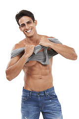 Image showing Man, portrait and smiling or pride for fashion in studio, happy and style by white background. Male person, abs and strong core or muscular abdomen, confident and results or progress from fitness