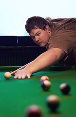 Image showing Man playing pool, game and aim with cue and ball, social event at sports bar or restaurant for contest. Competition, focus and serious player, billiard or snooker with concentration for target in pub