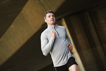 Image showing Man, runner and wellness on street in outdoors, cardio and exercise or training for marathon. Male person, athlete and workout by city background, sportswear and performance challenge by bridge