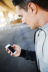 Image showing Man, runner and checking progress on phone, screen and exercise or training for marathon. Male person, athlete and workout by city background, mobile app and performance challenge or timer in outdoor