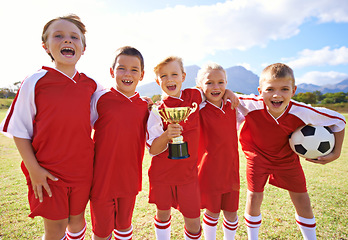 Image showing Victory, soccer team and children with cup, boys and girls with pride, support or proud. Achievement, sports and friendship, together and happy for win, ready for game and physical activity