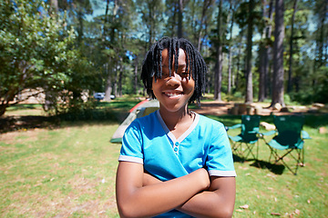 Image showing Child, portrait and smile on camping adventure in outdoors, happy and relaxing on vacation or holiday. Black male person, kid and face or confident in park, childhood and summer or freedom on lawn