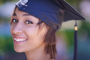 Image showing Woman, graduate and college success with education, cap and gown for ceremony outdoor. Academic, smile in portrait and graduation event for achievement, higher learning and certified with pride