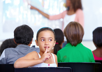 Image showing Hush sign, secret or child in classroom with mystery, gossip or fingers on mouth for quiet learning. Lips, news or girl student with whisper or shush gesture for rumor, drama or silence in school