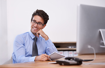 Image showing Businessman, thinking and smile for notes in notebook, contemplating ideas and pride in workplace. Male professional, planning and agenda for schedule or strategy, journal and solution or information