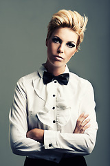 Image showing Portrait, bow tie and woman with fashion, vintage clothes and classy aesthetic on grey background. Arms crossed, edgy fashionable model or cool girl with retro style and makeup isolated in studio