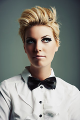 Image showing Thinking, bow tie or woman with fashion, ideas or vintage clothes on grey background in studio. Classy aesthetic, edgy female model or confident girl isolated with retro style, beauty and cool makeup