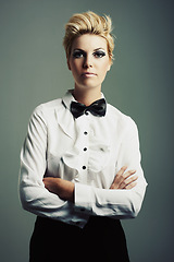 Image showing Portrait, bow tie or woman with fashion, vintage clothes and arms crossed on grey background. Classy aesthetic, edgy female model or confident girl with retro style and cool makeup isolated in studio