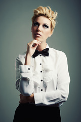 Image showing Thinking, bow tie or person with fashion, ideas or vintage clothes on grey background in studio. Classy aesthetic, edgy model or confident woman isolated with retro style, beauty and cool makeup