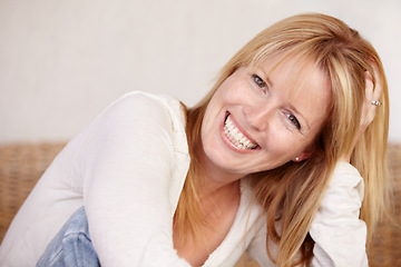 Image showing Happy, woman and smile with portrait on face, joyful and alone in home, natural beauty or headshot. Female, beautiful or thinking with idea, mature person and cheerful lady in house or blonde hair