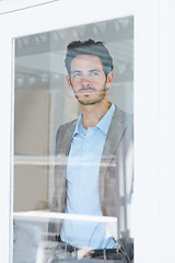 Image showing Man, serious by window and thinking of business ideas, brainstorming or reflection with insight and inspiration. Corporate professional, mission with decision and future in company with planning