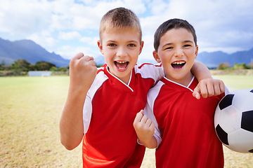 Image showing Happy boy, portrait and friends fist pump for soccer, winning or celebration on outdoor field. Excited male person, children or kids smile for football, victory or friendly game together in nature