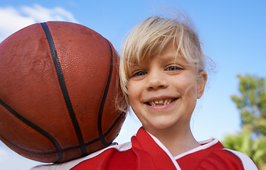 Image showing Happy girl, portrait and basketball for outdoor match, fun game or competition in nature. Face of young female person, kid or sports player smile with ball and cloudy blue sky for exercise in fitness