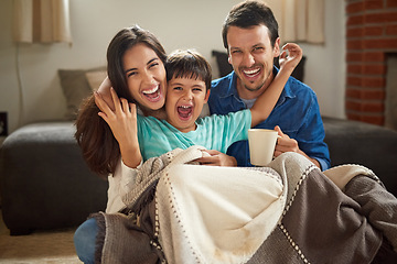 Image showing Hes brought a world of excitement to our lives. Shot of a cheerful young couple and their son spending some time together at home.