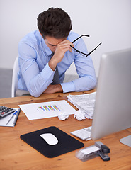 Image showing Business man, burnout and headache with graphs at desk, data analyst in office with vision problem and overworked. Anxiety, depression and fatigue, crisis or disaster with analytics deadline and pain