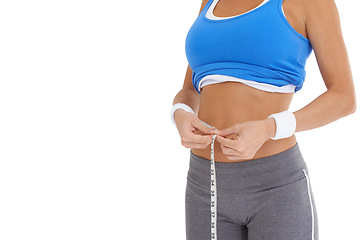 Image showing Woman, stomach and measure tape for diet, weight loss and health results or fitness progress in studio. Model hands check body or abdomen for exercise goals, training or workout on a white background