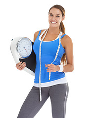 Image showing Scale, fitness and woman in studio for training results, wellness and workout with measure tape and portrait. Happy sports person or model for diet, lose weight or body progress on a white background