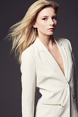 Image showing Woman, face and business clothes for fashion, beauty and wellness with confident model on dark background. Corporate jacket, ambition and power in portrait, professional style or outfit in studio