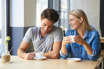 Image showing Coffee, cafe or happy couple laughing on date talking or speaking of anniversary on holiday vacation. Tea drink, woman or romantic man in conversation for care, love or support together to relax