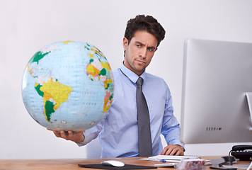 Image showing Travel, international or confused businessman with planet, earth or worldwide destination for trip in office. Agent, computer or professional person with map of planet for geography or journey choice