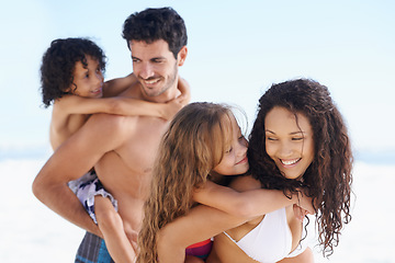 Image showing Happy family, beach and piggyback for bonding, vacation or outdoor holiday weekend together. Father, mother and children smile for hug, love or back ride on summer break by the ocean coast in nature