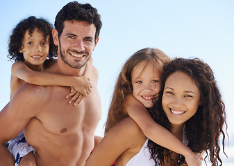 Image showing Happy family, portrait and piggyback for bonding, vacation or outdoor holiday weekend together. Father, mother and children smile for hug, love or back ride on summer break by ocean coast in nature