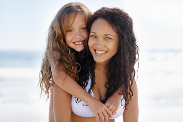 Image showing Happy mother, portrait and child hug at beach for summer holiday, bonding or outdoor love together. Face of mom and little girl, kid or daughter smile for embrace, support or piggyback at ocean coast