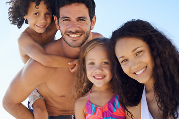 Image showing Happy family, portrait and beach for vacation, outdoor holiday weekend or bonding together. Face of father, mother and children smile for love, hug or piggyback for summer break by ocean in nature