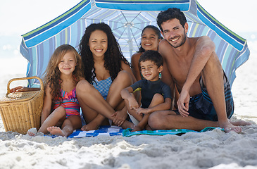 Image showing Parents, kids and happy in portrait on beach, summer vacation with family, bonding and love. People outdoor, holiday in Brazil with sand and sun, fun with smile for travel and adventure together