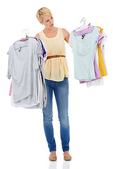 Image showing Woman, fashion and looking at clothing for choice, decision or selection on a white studio background. Female person, model or blonde thinking, wonder or picking garment or outfit for style on mockup