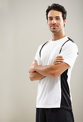 Image showing Arms crossed, portrait or athlete in studio for fitness workout, sports exercise or healthy wellness. Mockup space, grey background or man ready to start training with confidence, discipline or pride