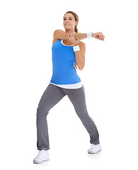 Image showing Sports, health and woman stretching in studio for arm exercise, training or workout. Fitness, smile and young female person with muscle warm up for wellness activity isolated by white background.
