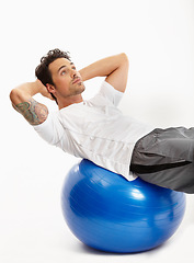 Image showing Ball, sit ups or man in studio training abdominal muscles for strong stomach in exercise for fitness. Abs, white background or healthy sports athlete in calisthenics for core, fitness or body workout