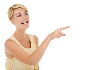 Image showing Happy woman, pointing and mockup space for advertising in marketing on a white studio background. Casual young female person, model or blonde smile showing notification, alert or special offer