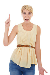 Image showing Happy woman, pointing up and surprise for idea, solution or answer on a white studio background. Portrait of young female person, model or blonde smile with finger for question, choice or decision