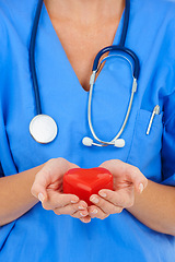 Image showing Heart, hands and cardiology nurse for healthcare, person with charity and support on white background. Cardiovascular health, trust and kindness with love, medical professional in studio and care