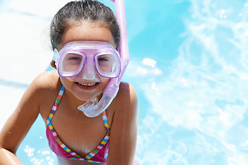 Image showing Pool, smile and portrait of child with goggles for swimming lesson, activity or hobby fun. Happy, snorkeling and girl kid with equipment for skill or tricks in water of outdoor backyard at home.