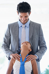 Image showing Smile, tie and father bonding with child in living room of family home together for love. Happy, care and dad talking or speaking to girl kid with youth for conversation or communication at house.